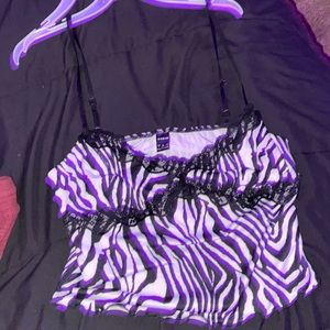 never worn zebra top, fits like a medium or large depending on cup size